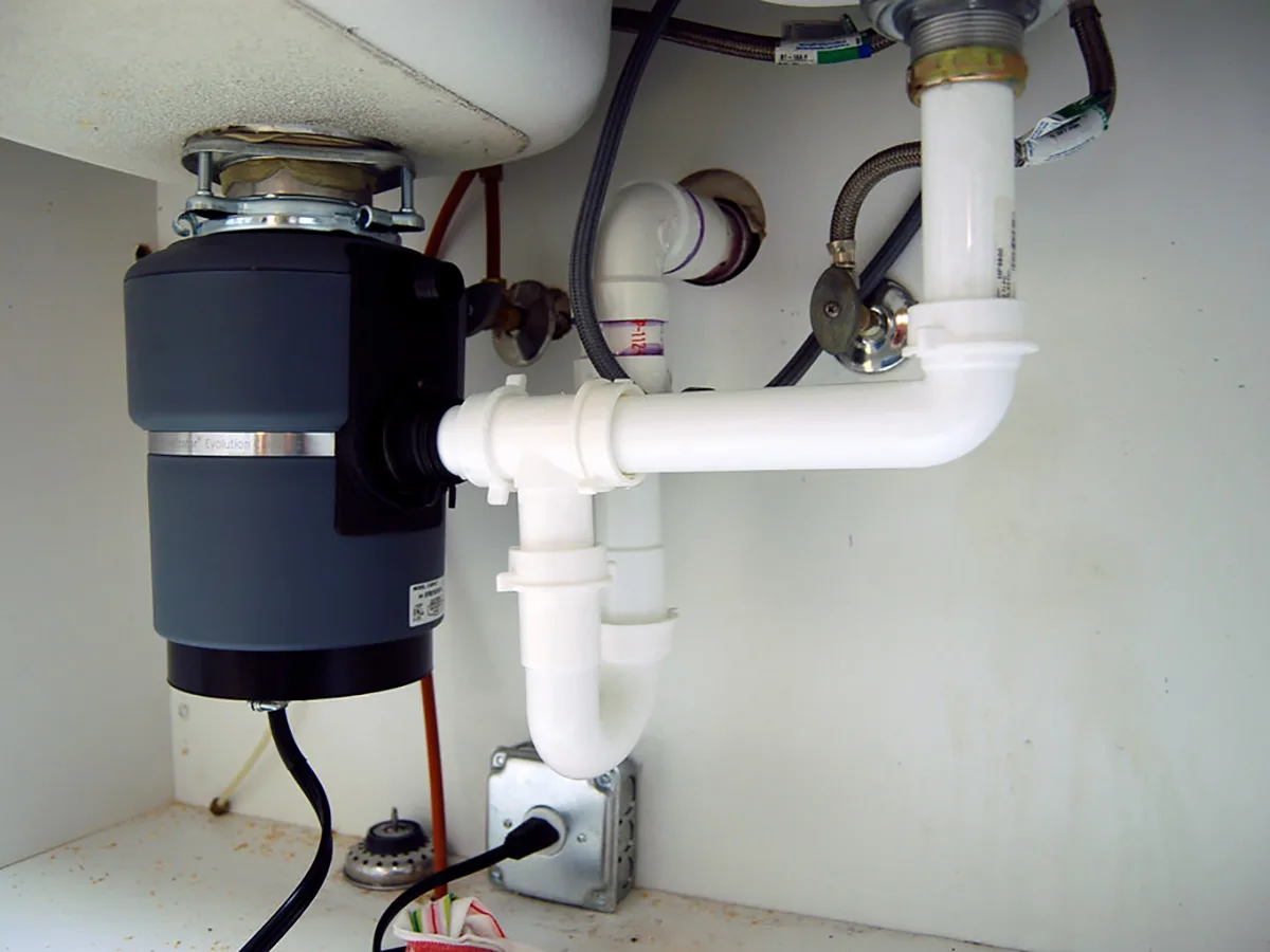 Installing a new garbage disposal in residential kitchen