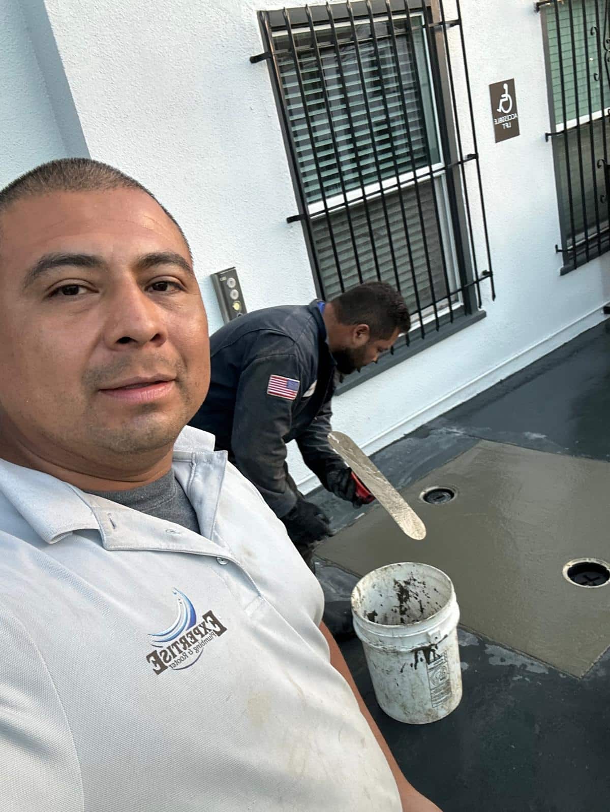 Plumber installing new piping system in an office building