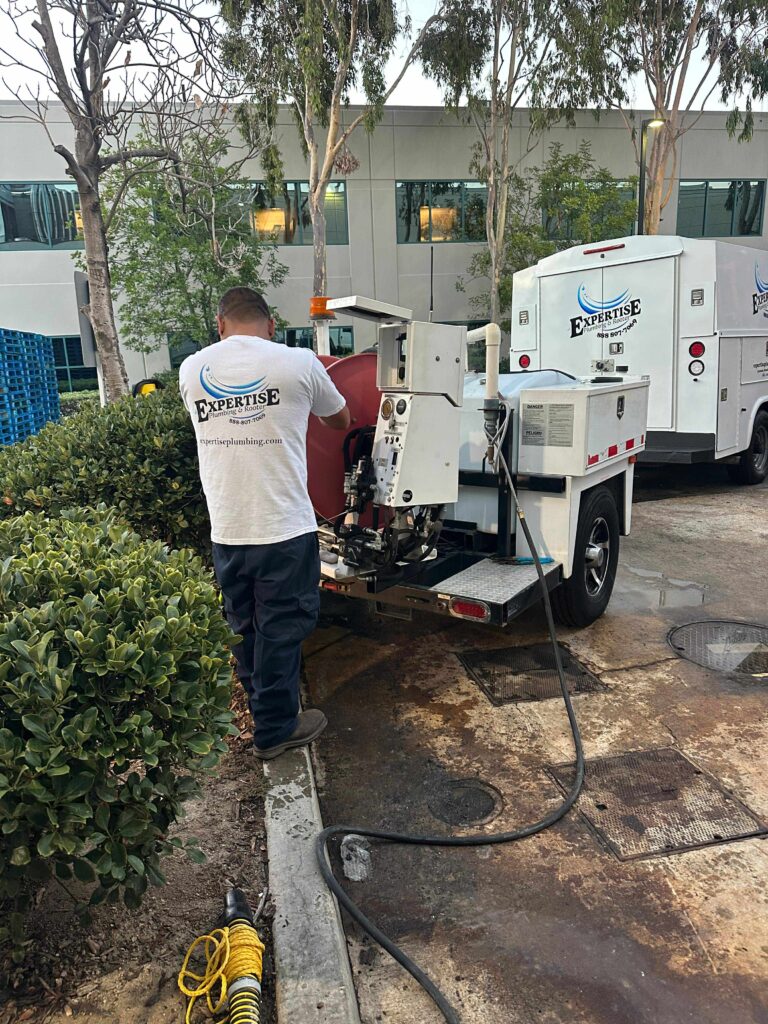 Hydro jetting cleaning stubborn grease and debris from drain