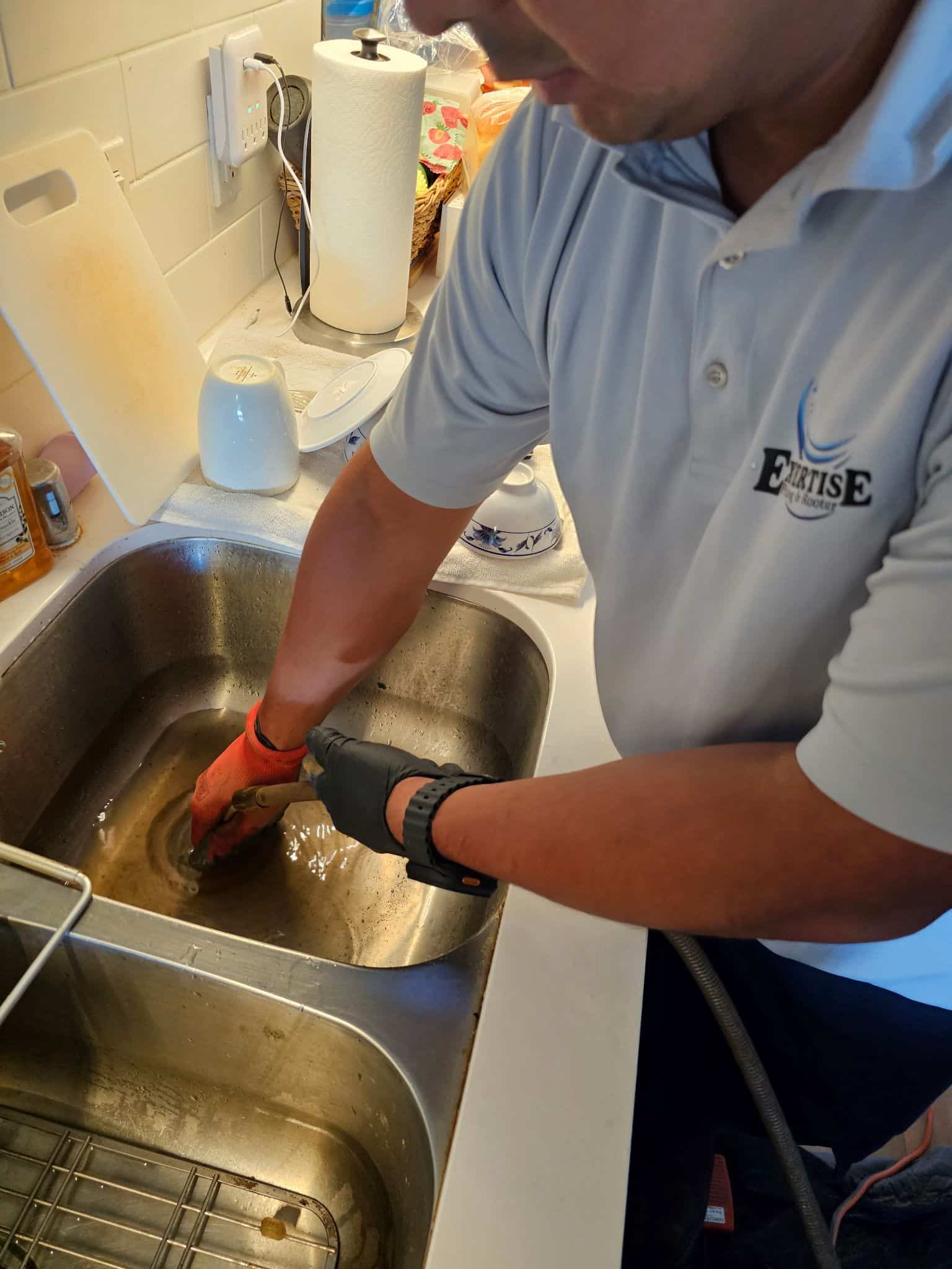 Emergency kitchen plumbing repair restoring water flow