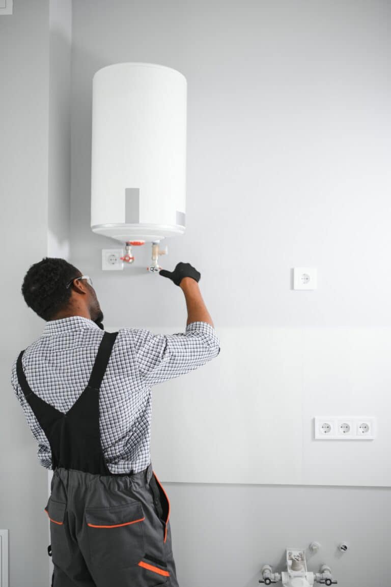 Man Working on Water Heater in Modern Home
