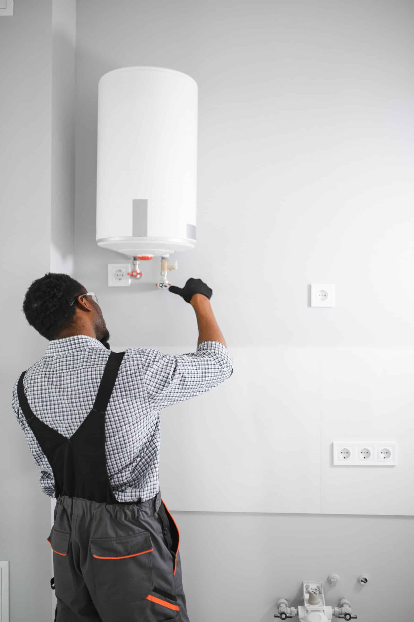 Man Working on Water Heater in Modern Home