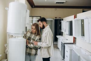Woman and Man Shopping for Appliances Indoors