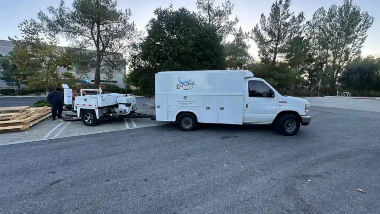 Expertise Plumbing utility truck and hydro jetting trailer